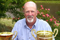 Leigh Eldredge with wine trophies